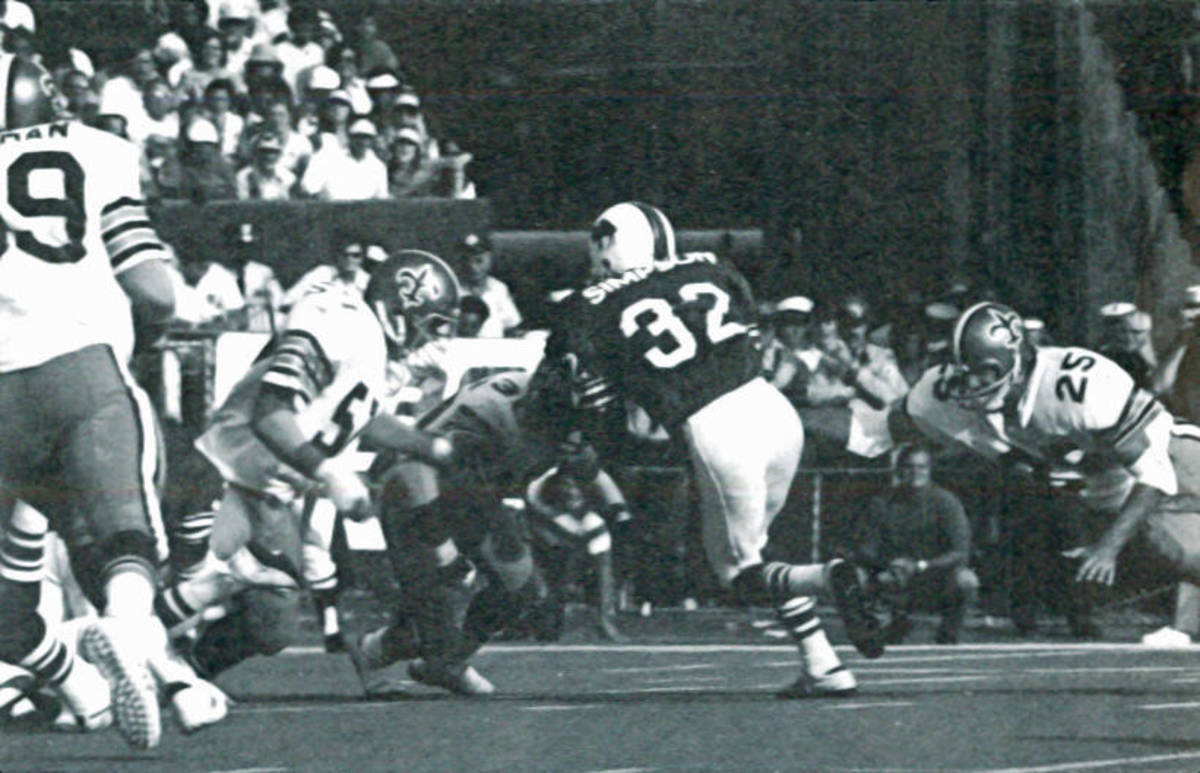The New Orleans defense surrounds Buffalo RB O.J. Simpson (32) during a 1973 contest. Credit: nosaintshistory.com